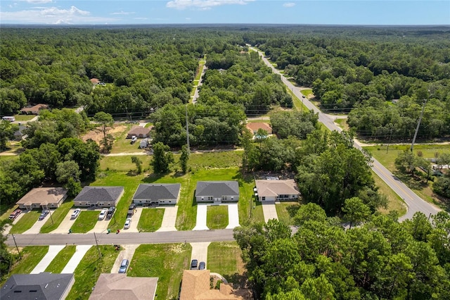 9011 N Travis Dr, Citrus Springs, FL 34434 - aerial view of residential area with a forest