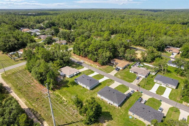 9011 N Travis Dr, Citrus Springs, FL 34434 - aerial view of residential area with a forest