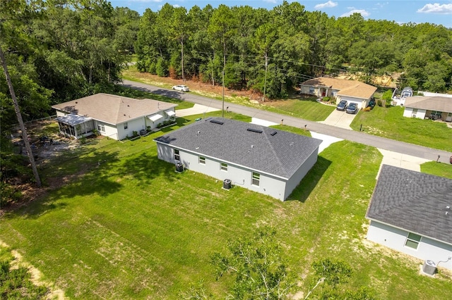 9011 N Travis Dr, Citrus Springs, FL 34434 - aerial view of property and surrounding area with a heavily wooded area