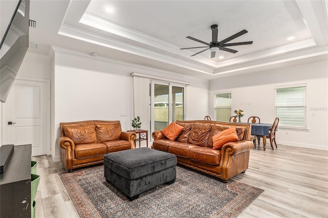 1425 SW 67th Dr, Gainesville, FL 32607 - living room featuring ceiling fan, a raised ceiling, light wood-style flooring, crown molding, and recessed lighting