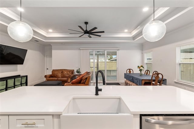 1425 SW 67th Dr, Gainesville, FL 32607 - kitchen featuring stainless steel dishwasher, open floor plan, a tray ceiling, crown molding, and decorative light fixtures