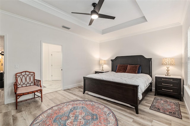 1425 SW 67th Dr, Gainesville, FL 32607 - bedroom featuring light wood-style flooring, a tray ceiling, crown molding, and ceiling fan