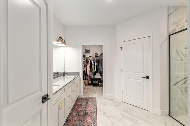 1425 SW 67th Dr, Gainesville, FL 32607 - full bathroom featuring marble look tile flooring, double vanity, and a spacious closet