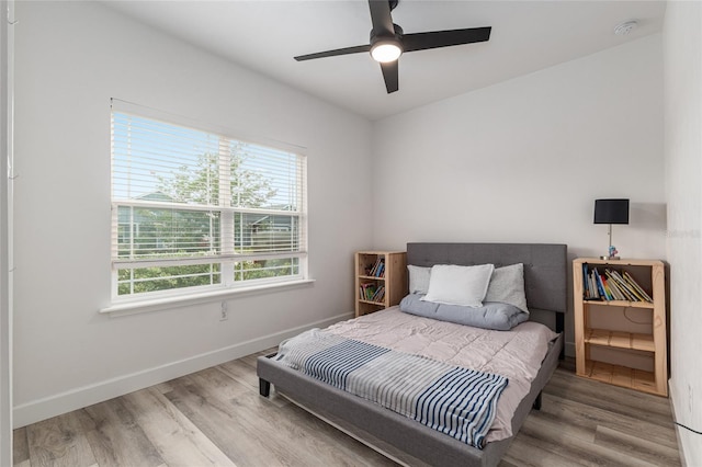 1425 SW 67th Dr, Gainesville, FL 32607 - bedroom with wood finished floors and ceiling fan