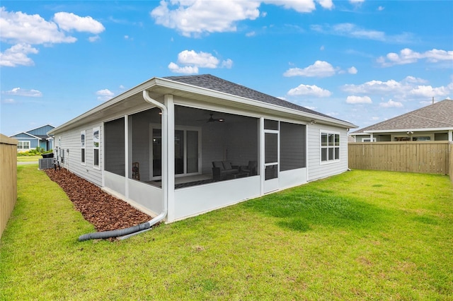 1425 SW 67th Dr, Gainesville, FL 32607 - rear view of house featuring a sunroom, a fenced backyard, ceiling fan, and roof with shingles