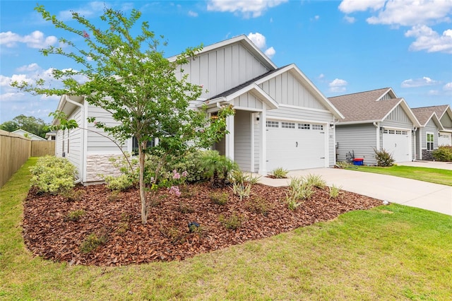 1425 SW 67th Dr, Gainesville, FL 32607 - view of front of house featuring board and batten siding, concrete driveway, a garage, and roof with shingles