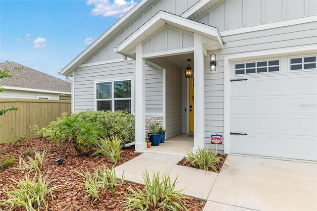 1425 SW 67th Dr, Gainesville, FL 32607 - view of exterior entry featuring board and batten siding