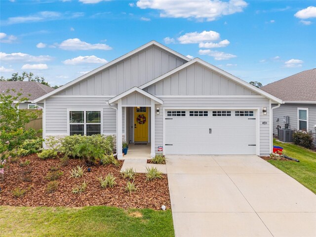 1425 SW 67th Dr, Gainesville, FL 32607 - ranch-style home featuring an attached garage, board and batten siding, driveway, and a front lawn