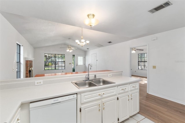 2963 SW 40th Ave, Gainesville, FL 32608 - kitchen featuring white dishwasher, a ceiling fan, vaulted ceiling, a chandelier, and light wood-type flooring
