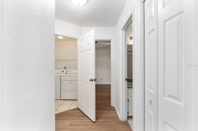 2963 SW 40th Ave, Gainesville, FL 32608 - corridor featuring independent washer and dryer and light wood-type flooring