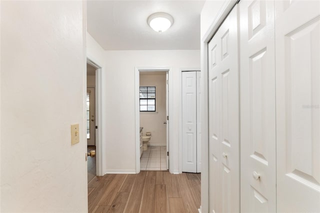 2963 SW 40th Ave, Gainesville, FL 32608 - hall with light wood-style flooring and baseboards