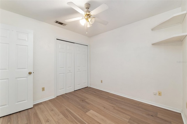 2963 SW 40th Ave, Gainesville, FL 32608 - unfurnished bedroom with light wood-type flooring, a closet, and ceiling fan
