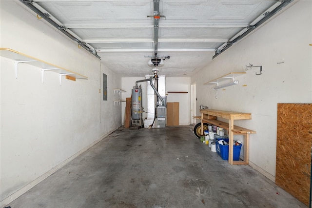 2963 SW 40th Ave, Gainesville, FL 32608 - garage featuring gas water heater, electric panel, heating unit, and a workshop area
