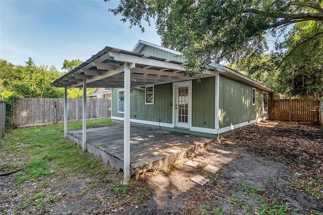 2963 SW 40th Ave, Gainesville, FL 32608 - rear view of house with a wooden deck and a fenced backyard