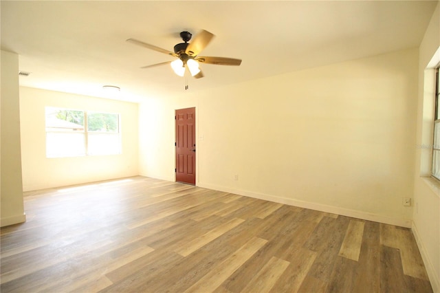 706 NE 24th St, Gainesville, FL 32641 - unfurnished room with a ceiling fan and wood finished floors