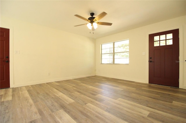706 NE 24th St, Gainesville, FL 32641 - foyer with light wood-style flooring and a ceiling fan
