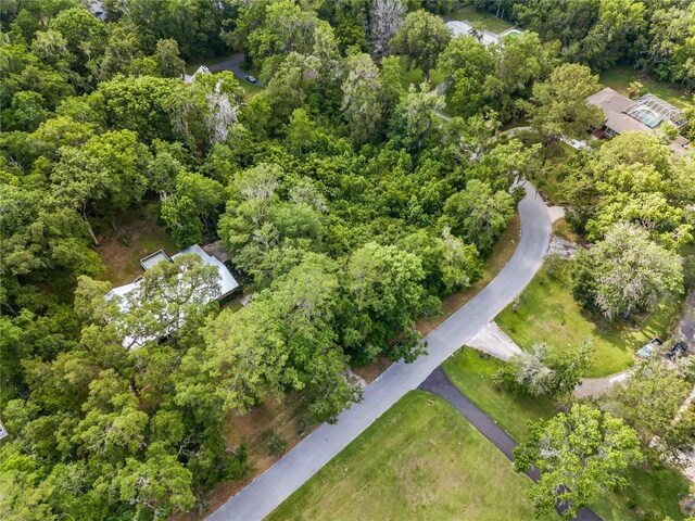 820 NW 109th Dr, Gainesville, FL 32606 - aerial overview of property's location with a heavily wooded area