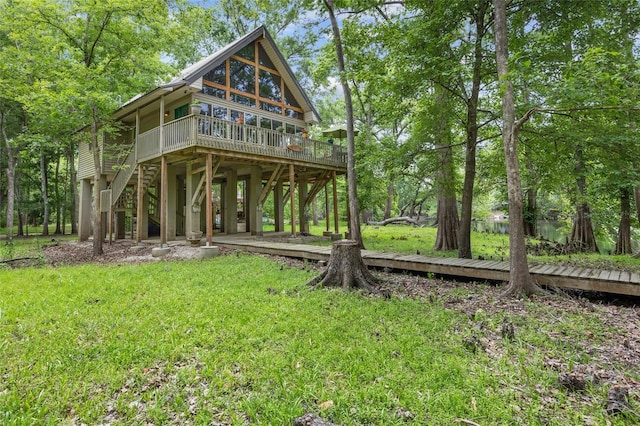 174 SW Meridian Ct, Fort White, FL 32038 - back of house featuring a deck and a yard
