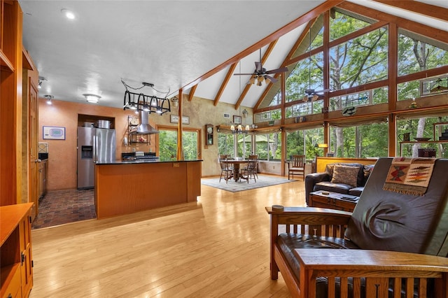 174 SW Meridian Ct, Fort White, FL 32038 - living area with ceiling fan, light wood-type flooring, high vaulted ceiling, and beamed ceiling
