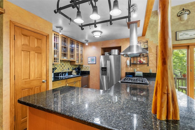 174 SW Meridian Ct, Fort White, FL 32038 - kitchen with appliances with stainless steel finishes, decorative backsplash, glass insert cabinets, a peninsula, and island range hood