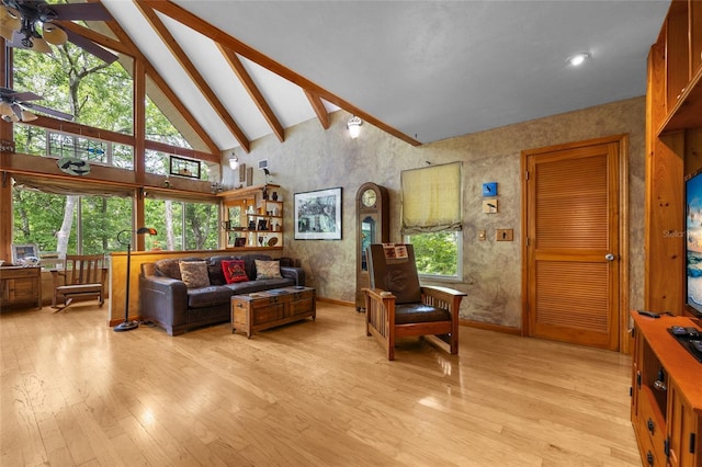 174 SW Meridian Ct, Fort White, FL 32038 - living room with a ceiling fan, beamed ceiling, light wood-type flooring, and high vaulted ceiling