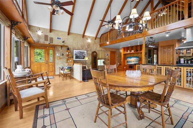 174 SW Meridian Ct, Fort White, FL 32038 - dining area featuring high vaulted ceiling, ceiling fan, light wood-style floors, a chandelier, and beamed ceiling