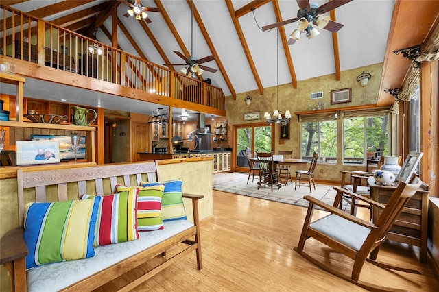 174 SW Meridian Ct, Fort White, FL 32038 - dining space with high vaulted ceiling, ceiling fan, wood finished floors, beam ceiling, and stairway
