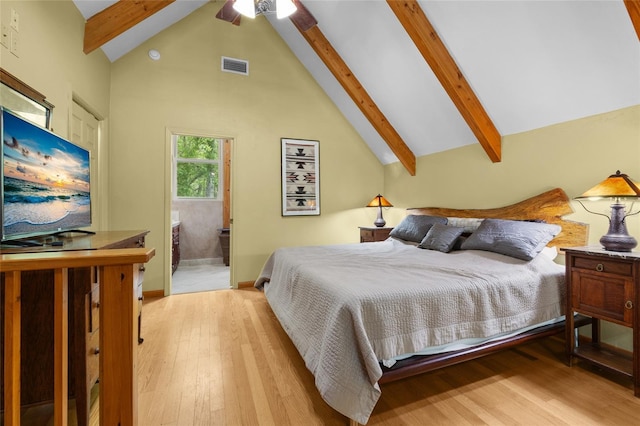 174 SW Meridian Ct, Fort White, FL 32038 - bedroom featuring beam ceiling, light wood-style floors, high vaulted ceiling, and ensuite bath