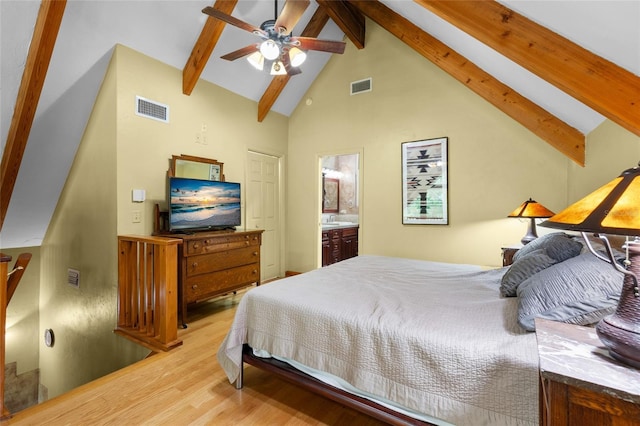 174 SW Meridian Ct, Fort White, FL 32038 - bedroom with beamed ceiling, wood finished floors, high vaulted ceiling, ensuite bathroom, and a ceiling fan