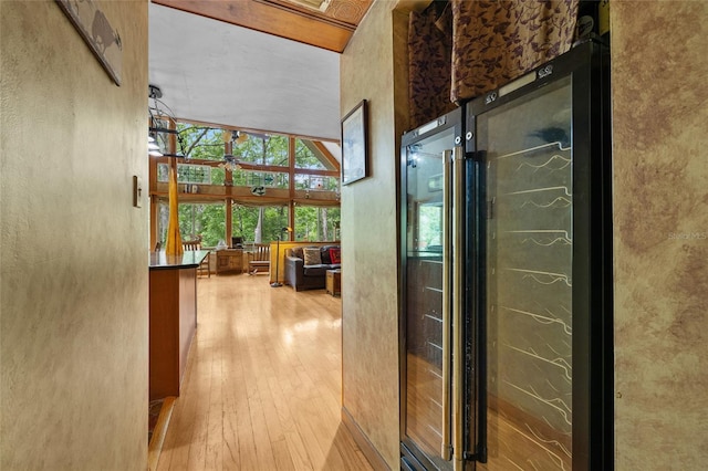 174 SW Meridian Ct, Fort White, FL 32038 - corridor featuring wine cooler and wood-type flooring