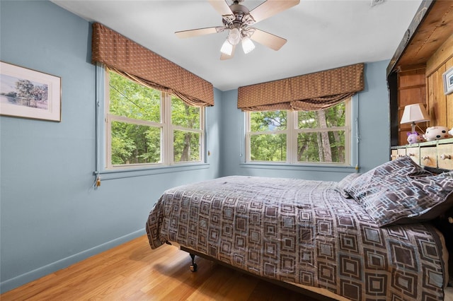 174 SW Meridian Ct, Fort White, FL 32038 - bedroom with wood finished floors and a ceiling fan