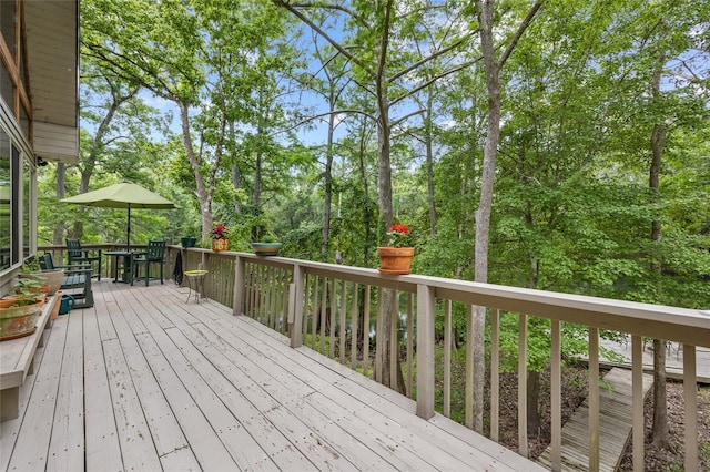174 SW Meridian Ct, Fort White, FL 32038 - deck featuring outdoor dining area and view of scattered trees