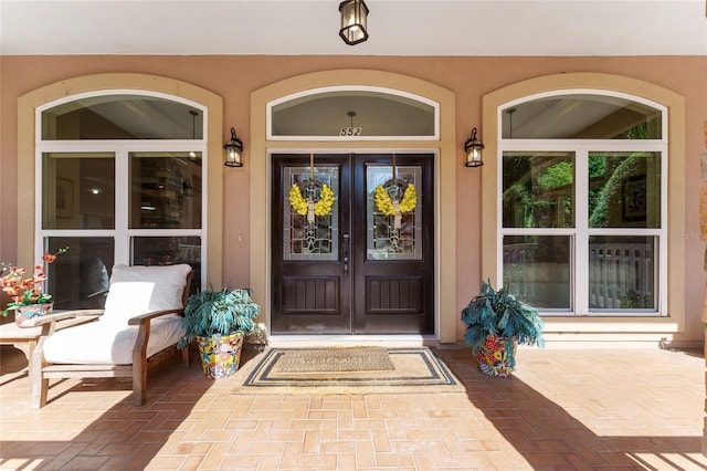 552 NW 136th St, Newberry, FL 32669 - property entrance featuring french doors and stucco siding