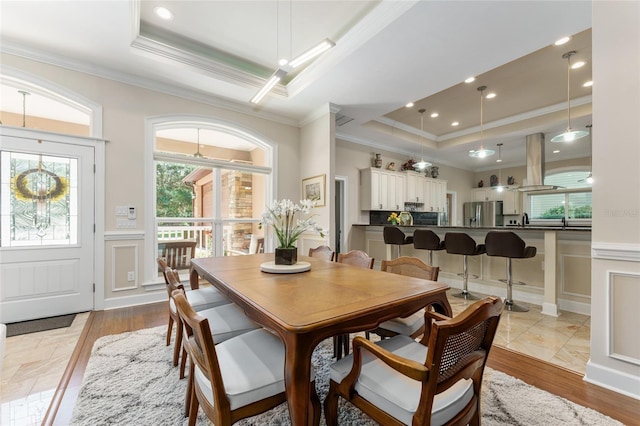 552 NW 136th St, Newberry, FL 32669 - dining room with a raised ceiling, ornamental molding, a decorative wall, and wainscoting