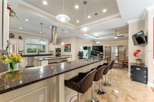 552 NW 136th St, Newberry, FL 32669 - kitchen with island range hood, dishwasher, plenty of natural light, stone tile floors, and recessed lighting