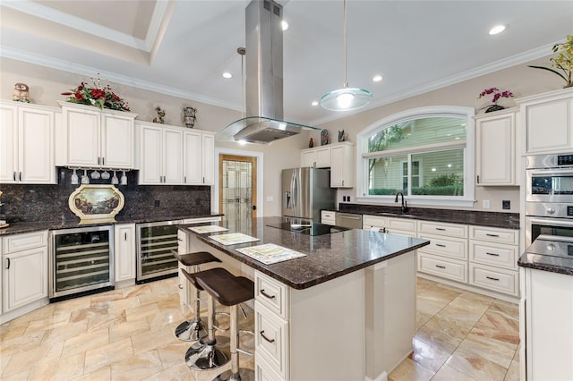 552 NW 136th St, Newberry, FL 32669 - kitchen with beverage cooler, appliances with stainless steel finishes, island range hood, tasteful backsplash, and ornamental molding