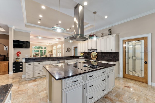 552 NW 136th St, Newberry, FL 32669 - kitchen featuring island exhaust hood, black electric cooktop, a peninsula, ornamental molding, and a raised ceiling