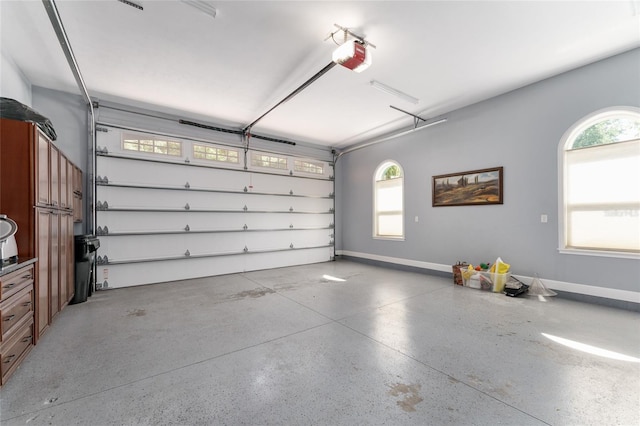552 NW 136th St, Newberry, FL 32669 - garage with a garage door opener and baseboards