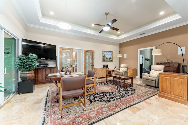 552 NW 136th St, Newberry, FL 32669 - living room with a raised ceiling, crown molding, ceiling fan, and light stone finish flooring