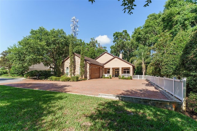 552 NW 136th St, Newberry, FL 32669 - view of front of home featuring an attached garage and decorative driveway