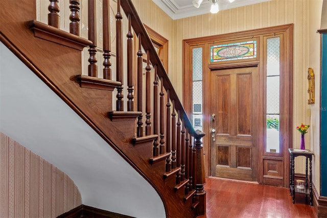 708 E University Ave, Gainesville, FL 32601 - foyer with wallpapered walls, wood finished floors, crown molding, and stairs