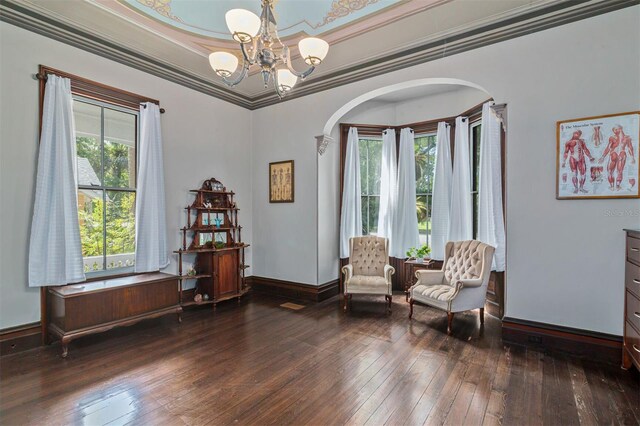 708 E University Ave, Gainesville, FL 32601 - living area featuring hardwood / wood-style floors, arched walkways, a chandelier, and crown molding