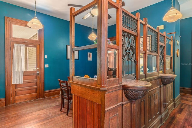 708 E University Ave, Gainesville, FL 32601 - bar featuring hardwood / wood-style floors, ceiling fan, and pendant lighting
