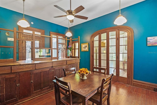 708 E University Ave, Gainesville, FL 32601 - dining space with dark wood-type flooring and a ceiling fan