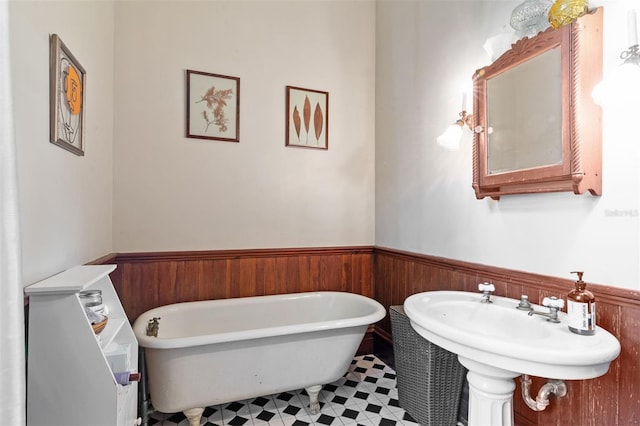 708 E University Ave, Gainesville, FL 32601 - full bathroom featuring wainscoting and a freestanding tub