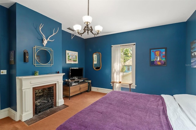 708 E University Ave, Gainesville, FL 32601 - bedroom with carpet, a chandelier, and a fireplace with flush hearth
