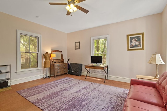 708 E University Ave, Gainesville, FL 32601 - living area featuring ceiling fan and baseboards