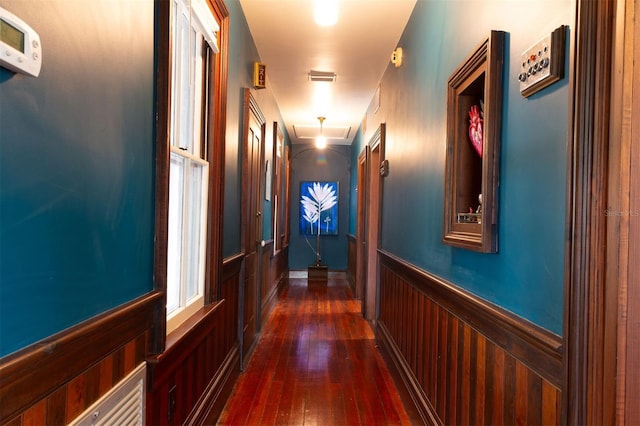 708 E University Ave, Gainesville, FL 32601 - hallway featuring attic access, dark wood-style flooring, and a wainscoted wall