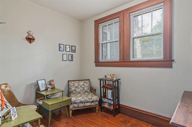 708 E University Ave, Gainesville, FL 32601 - living area featuring wood finished floors and baseboards
