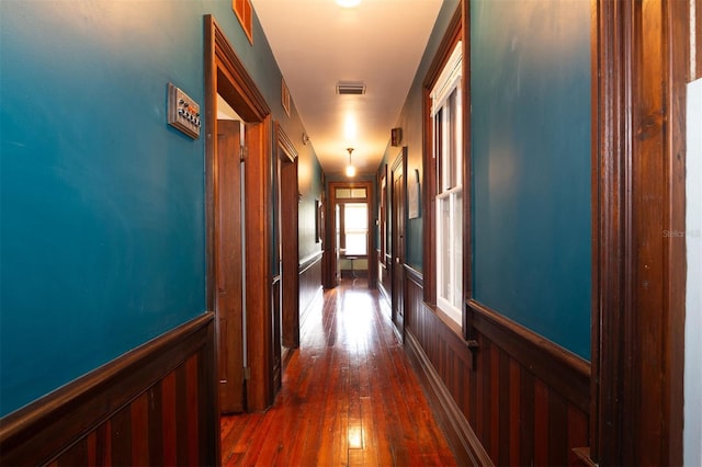 708 E University Ave, Gainesville, FL 32601 - hall featuring a wainscoted wall and dark wood-type flooring
